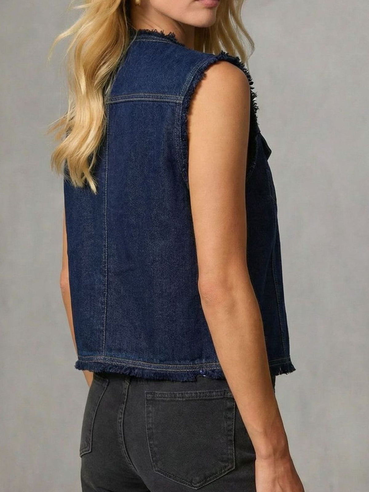 Frayed hem denim vest from Trendsi featuring distressed details and classic sleeveless design, styled with casual streetwear.