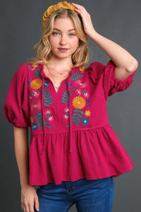 Plus size Umgee floral embroidery cotton gauze babydoll blouse with lace details, featuring a relaxed fit and feminine design.
