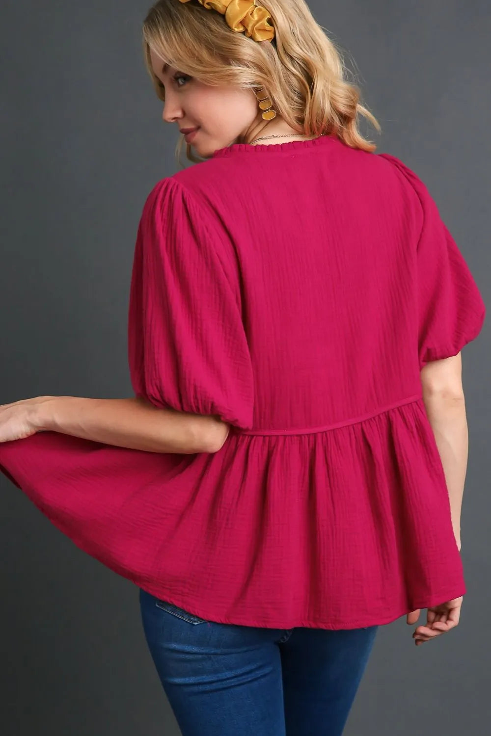 Plus size Umgee cotton gauze babydoll blouse with floral embroidery, featuring a flowy design and short sleeves.