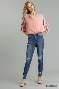 Blue Umgee distressed skinny jeans with pockets, featuring a fitted style and casual denim look.