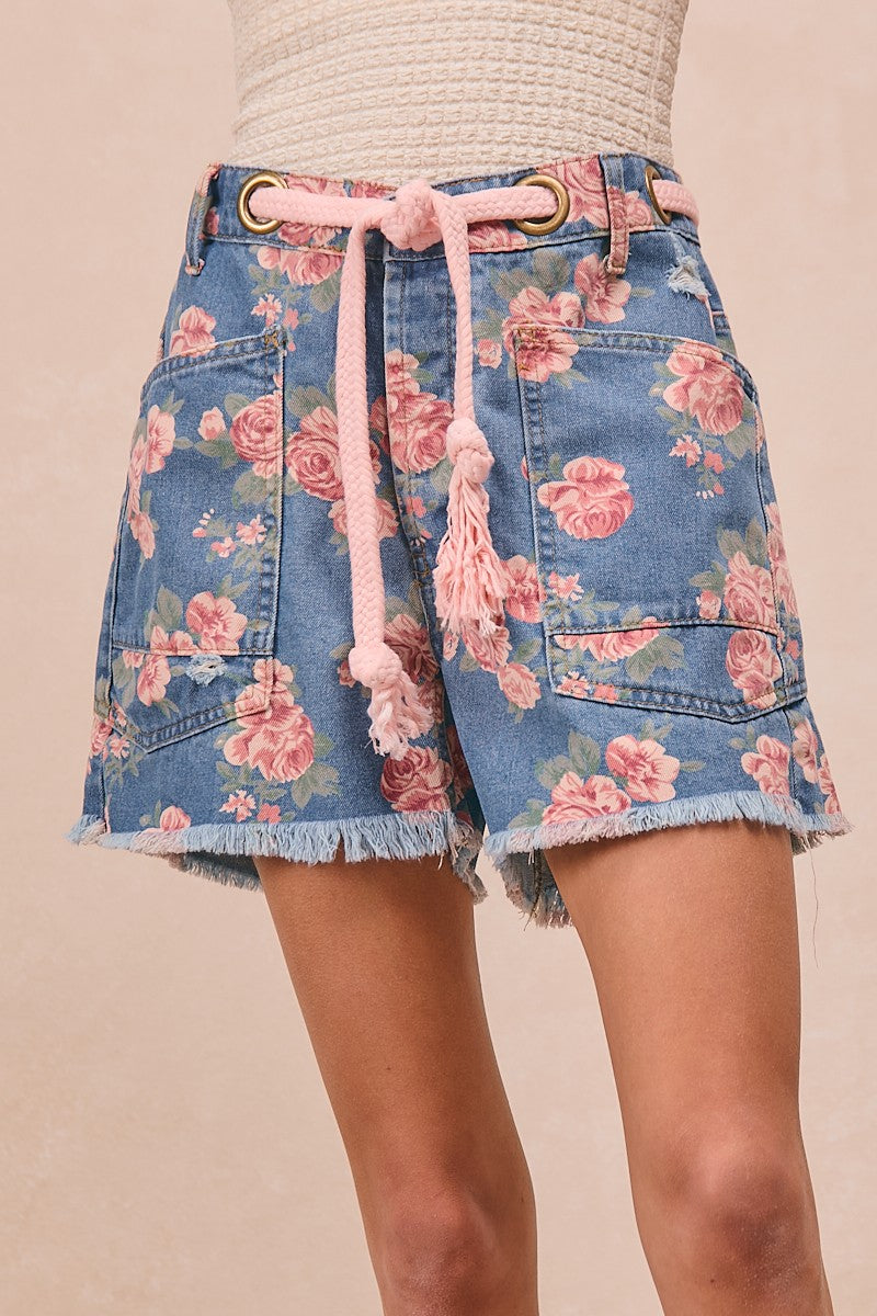 Trendsi BiBi braided waist belt with patch pockets on floral print denim shorts, showcasing stylish summer casual wear.