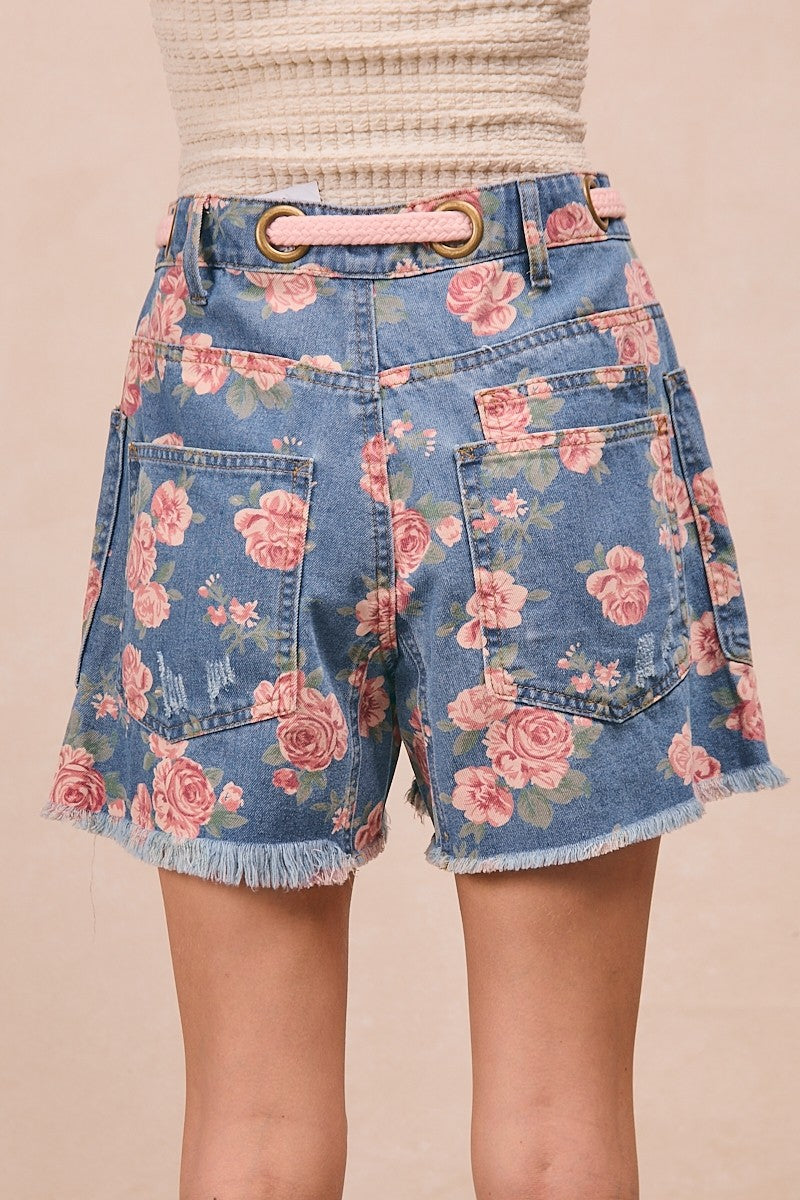 Trendsi BiBi braided waist belt with patch pockets and floral print denim shorts, showcasing stylish design and casual summer fashion.