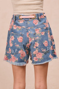 Trendsi BiBi braided waist belt with patch pockets and floral print denim shorts, showcasing stylish design and casual summer fashion.
