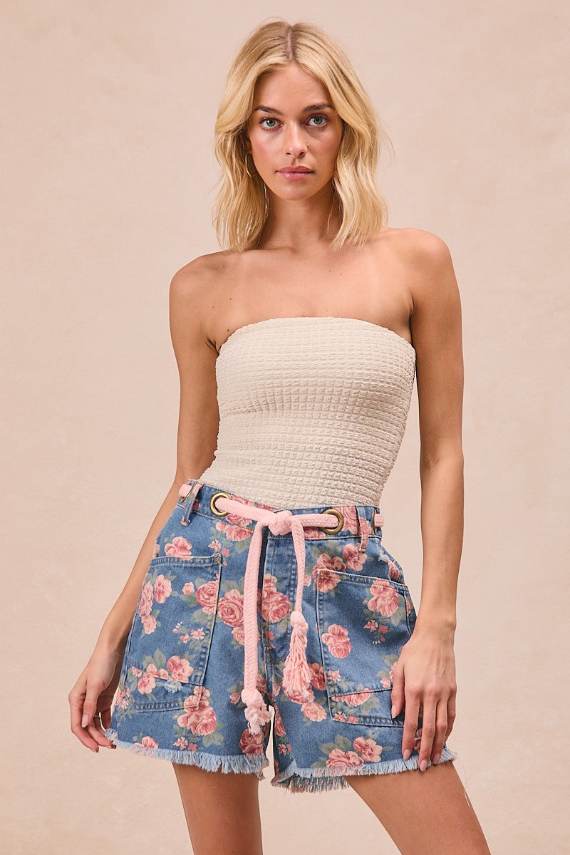 Trendsi BiBi braided waist belt with patch pockets on floral print denim shorts, showcasing stylish casual summer wear.