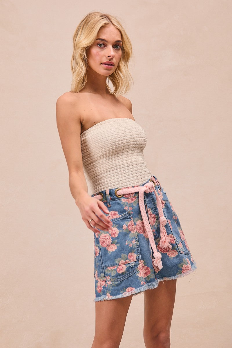 Trendsi BiBi braided waist belt with patch pockets on floral print denim shorts featuring a casual, stylish summer look.