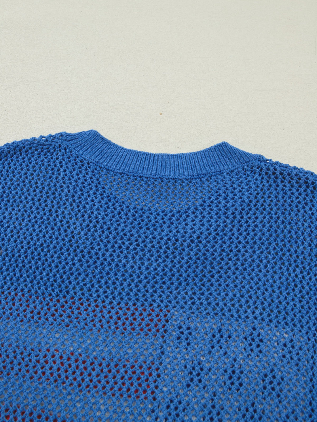 Dusty blue short sleeve sweater top with flag graphic by Trendsi, showcasing a casual, stylish design perfect for everyday wear.