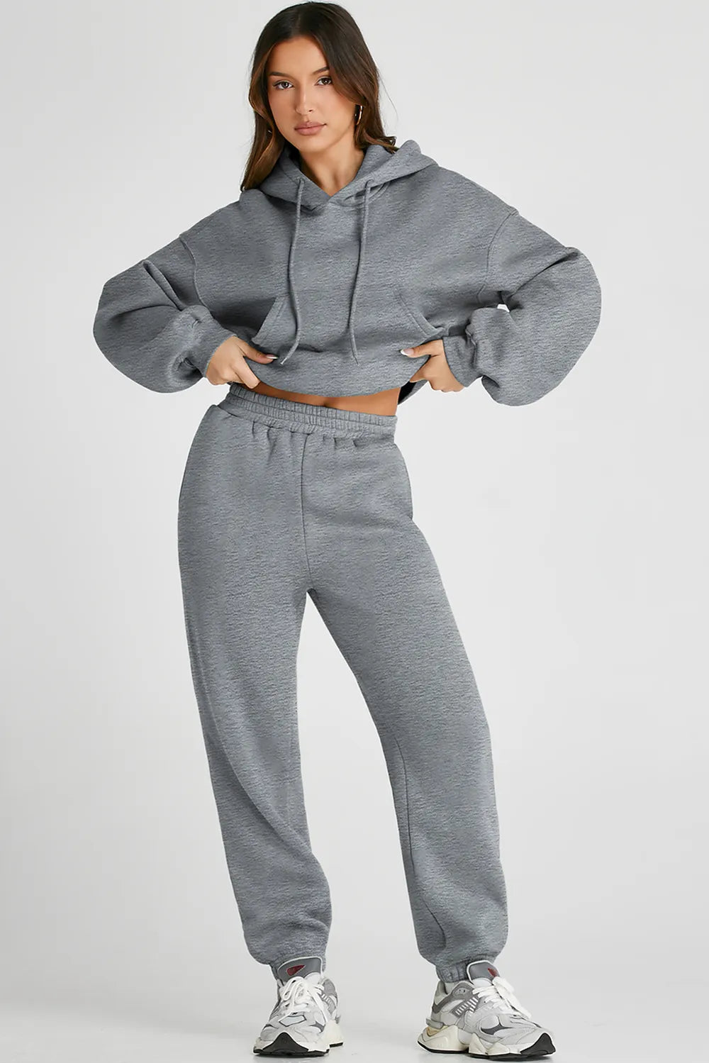Dropped shoulder hooded top and pants active set by Trendsi, featuring a relaxed fit with hood and matching jogger pants.