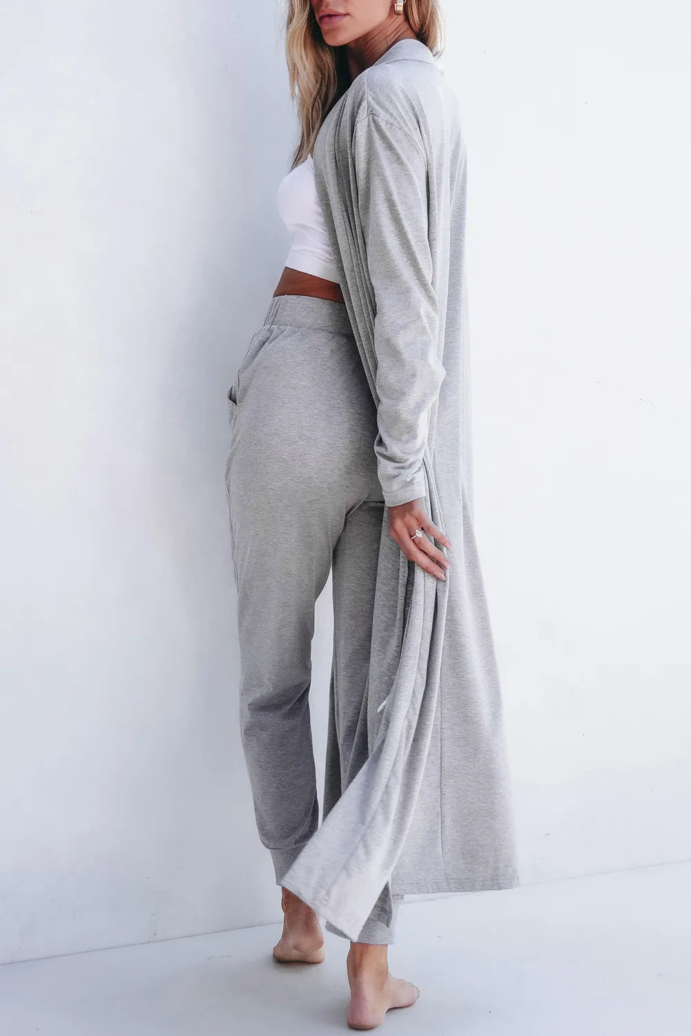 Gray open-front long sleeve cardigan and matching lounge pants set from Trendsi, cozy and stylish for relaxed wear.