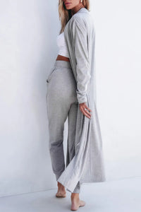 Gray open-front long sleeve cardigan and matching lounge pants set from Trendsi, cozy and stylish for relaxed wear.