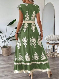 Green printed V-neck dress with ruffled cap sleeves, stylish and lightweight, from Trendsi.