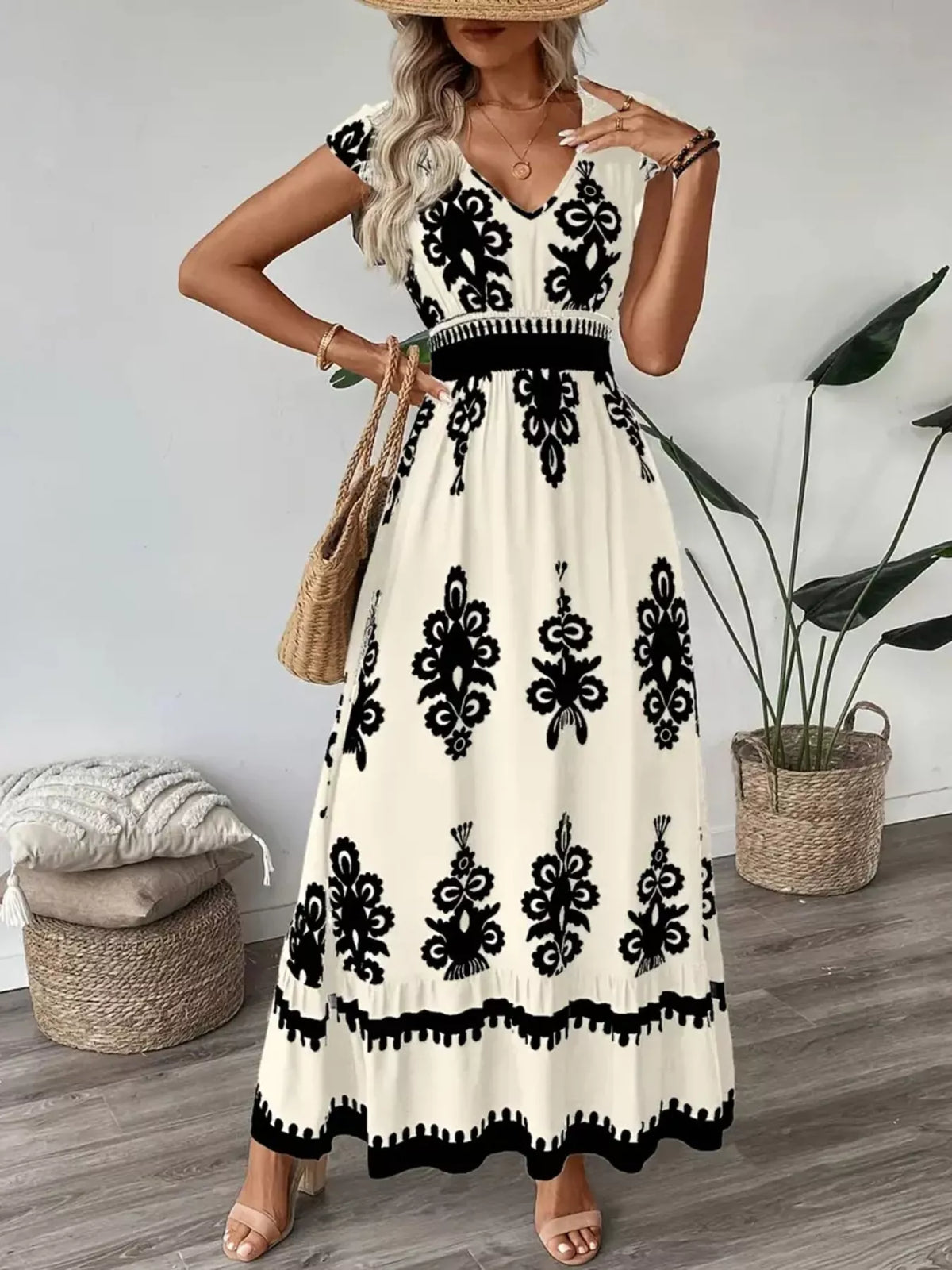 Green printed V-neck dress by Trendsi featuring ruffled cap sleeves and a flowy, feminine design.