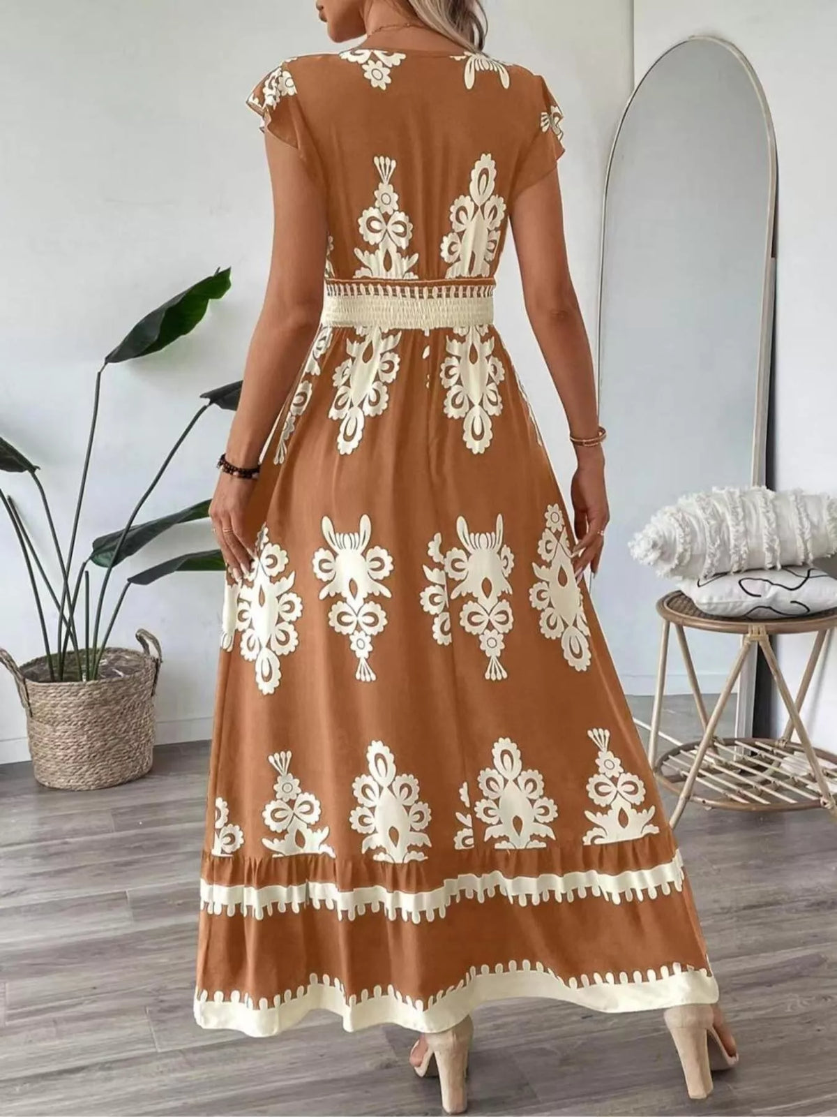 Green printed V-neck dress with ruffled cap sleeves by Trendsi, showcasing a stylish and feminine design.