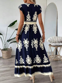 Green printed V-neck dress with ruffled cap sleeves by Trendsi, featuring a stylish and feminine design.