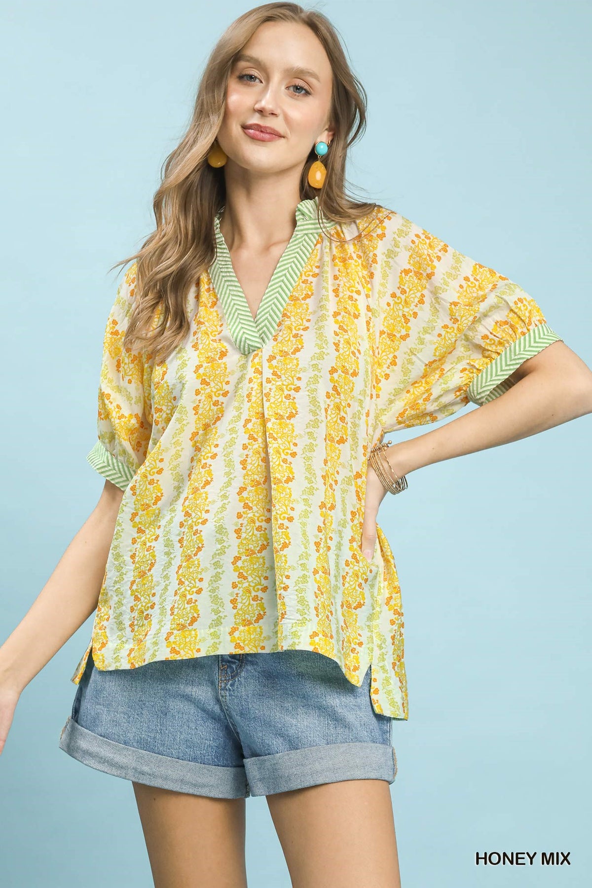 Mix print boho blouse with contrast trim, featuring relaxed fit and vibrant patterns, perfect for casual and stylish looks.