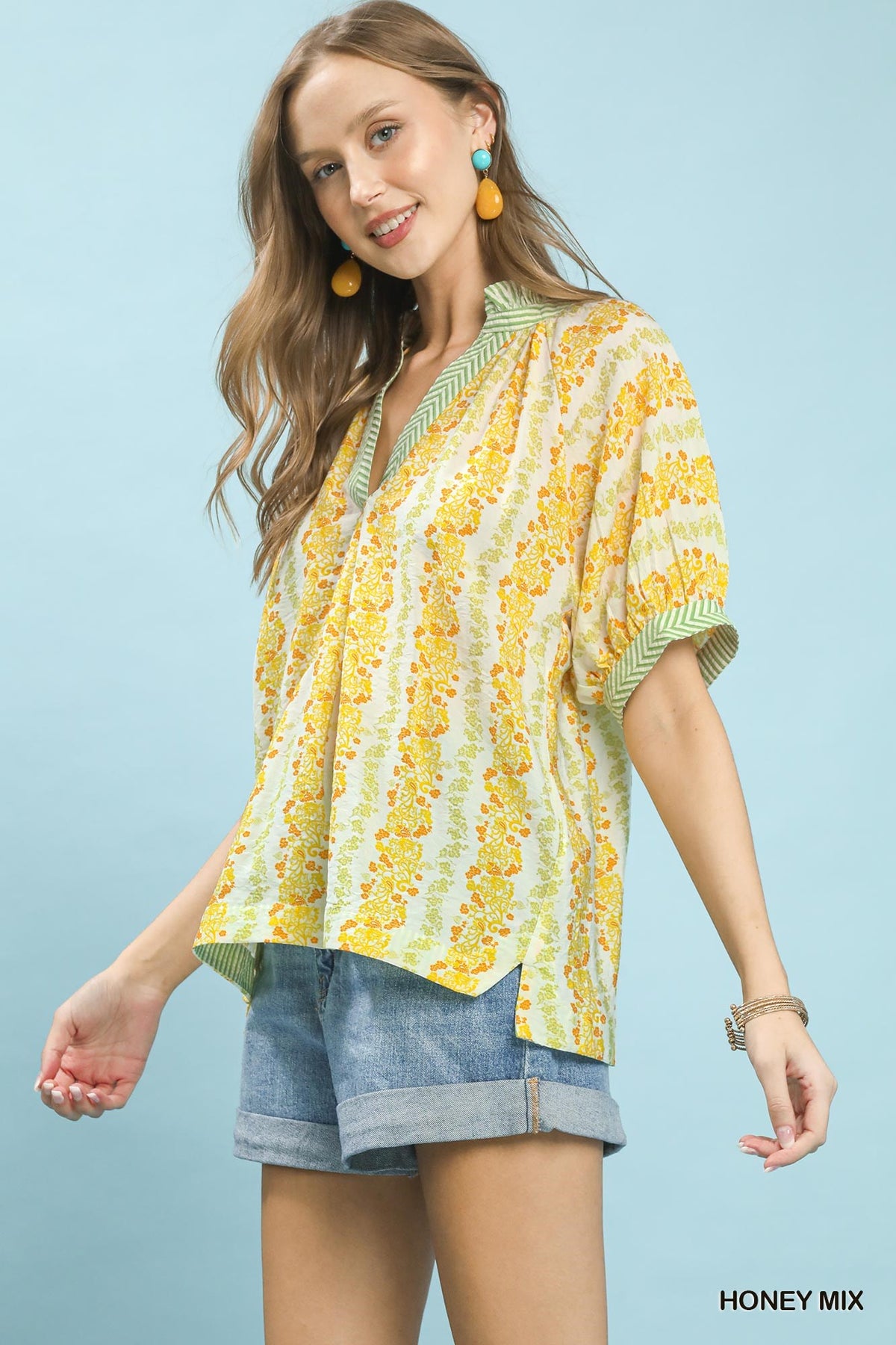 Boho Mix Print Blouse with Contrast Trim by Trendsi featuring flowy fabric and vibrant patterns in a stylish design