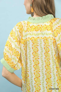 Boho blouse with mixed print and contrast trim from Trendsi, featuring flowy fabric and stylish bohemian design.