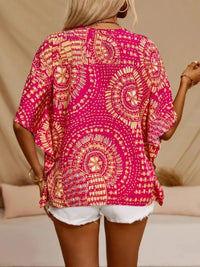 Hot pink printed V-neck half sleeve top from Trendsi, showing close-up of fabric and stylish design.