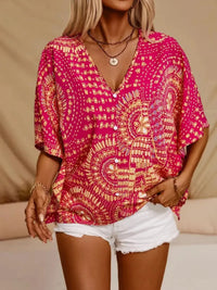Hot pink printed V-neck half sleeve top from Trendsi, showcasing a stylish, casual women's fashion top with vibrant pattern.