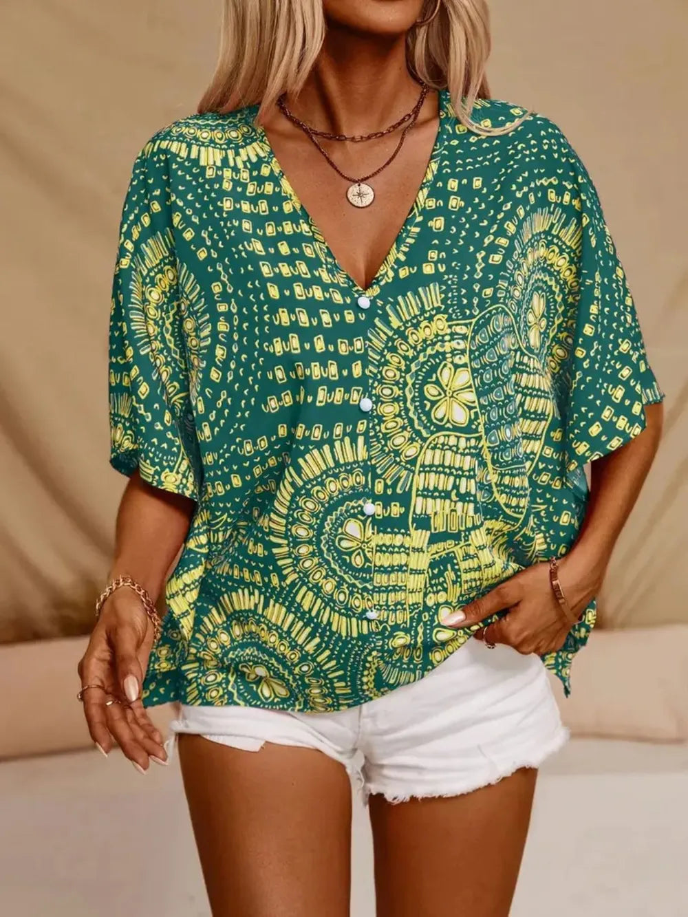 Hot pink printed V-neck half sleeve top by Trendsi, showcasing a stylish design and comfortable fit.
