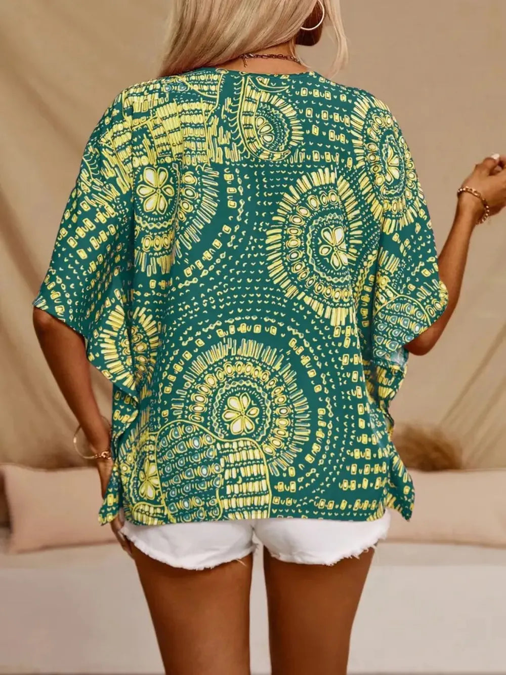 Hot pink printed V-neck half sleeve top from Trendsi, showcasing a stylish and comfortable casual women's shirt.