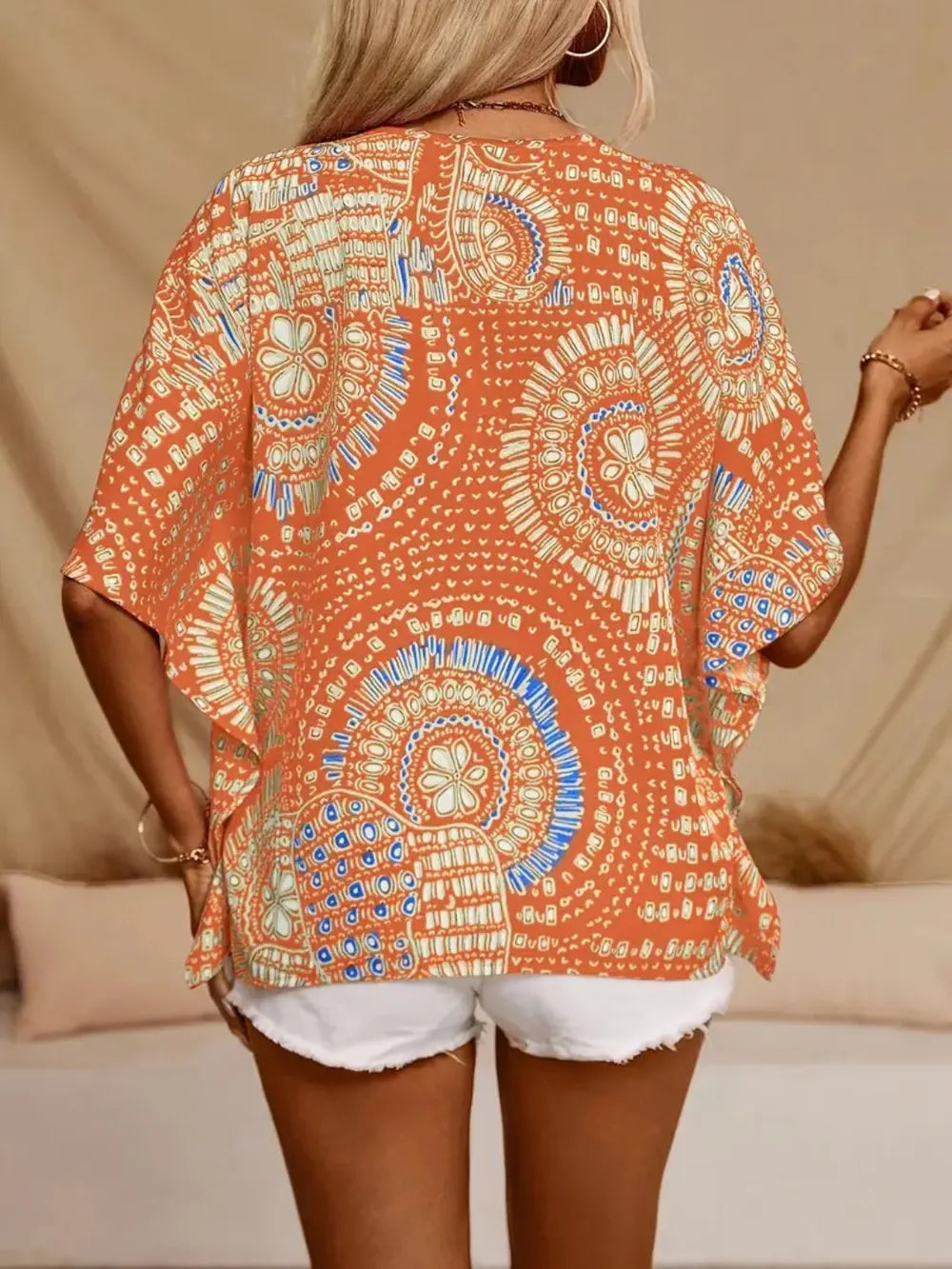 Hot pink printed V-neck half sleeve top by Trendsi, featuring a stylish design and comfortable fit.