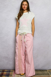 Trendsi POL Star round neck popcorn knit top with long sleeves, soft textured fabric, in a stylish casual design.