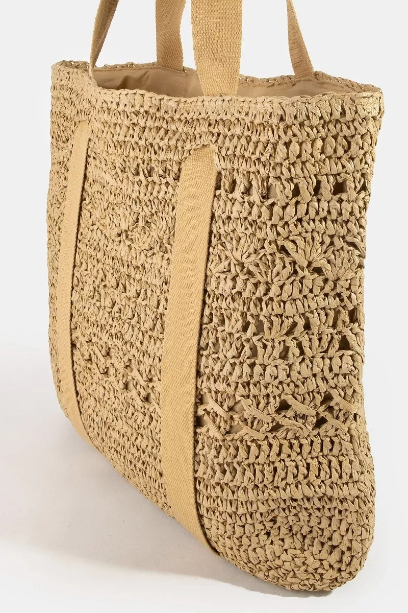 Large straw braided tote bag with hat holder, trendy and spacious, perfect for summer outings and beach trips.