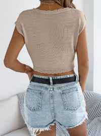 Openwork cap sleeve sweater top from Trendsi featuring lightweight knit fabric and stylish openwork details.