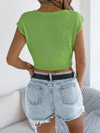 Openwork cap sleeve sweater top by Trendsi featuring a lightweight design with intricate openwork details and a stylish cap sleeve.