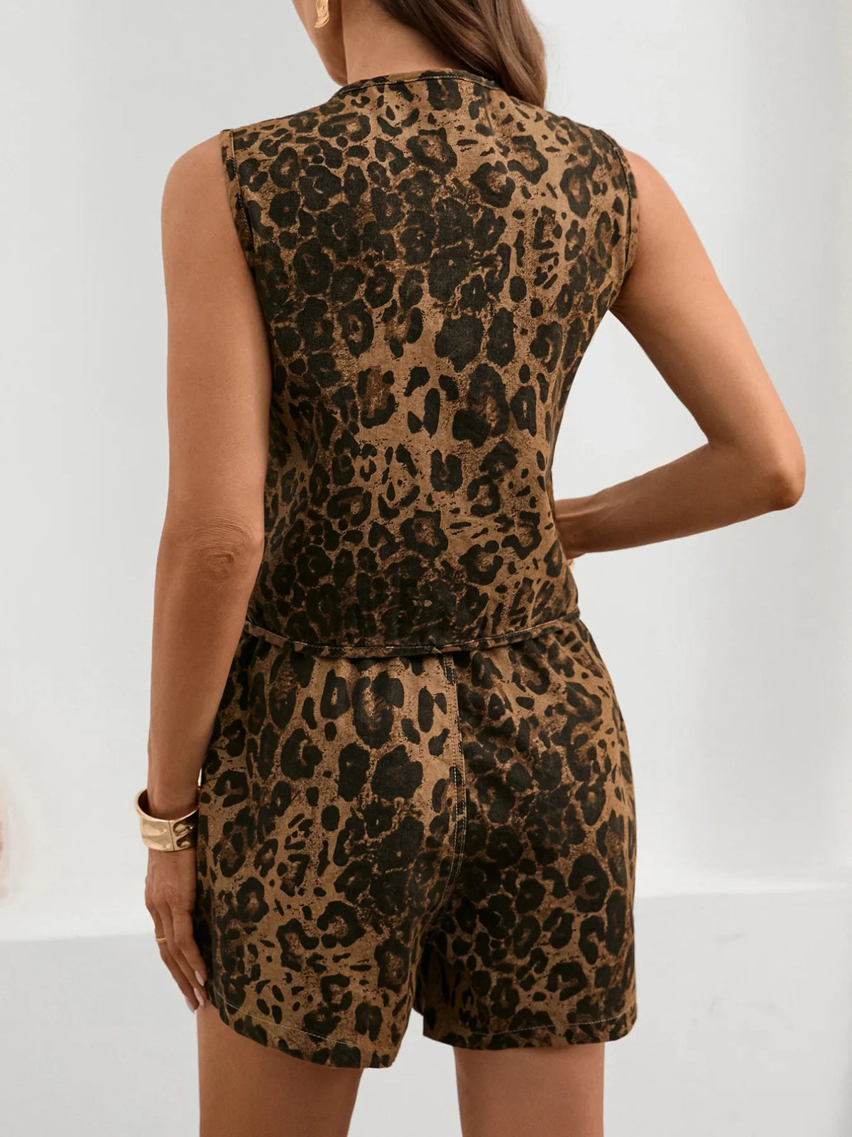 Leopard print sleeveless denim top from Trendsi featuring a casual fit and classic sleeveless design.