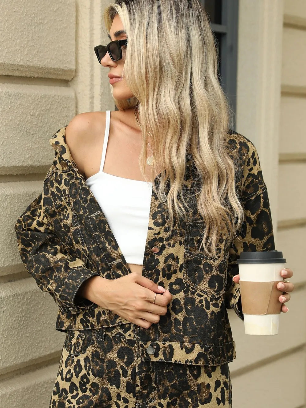 Leopard print long sleeve denim jacket with pockets by Trendsi, featuring a stylish, casual design and button front detail.