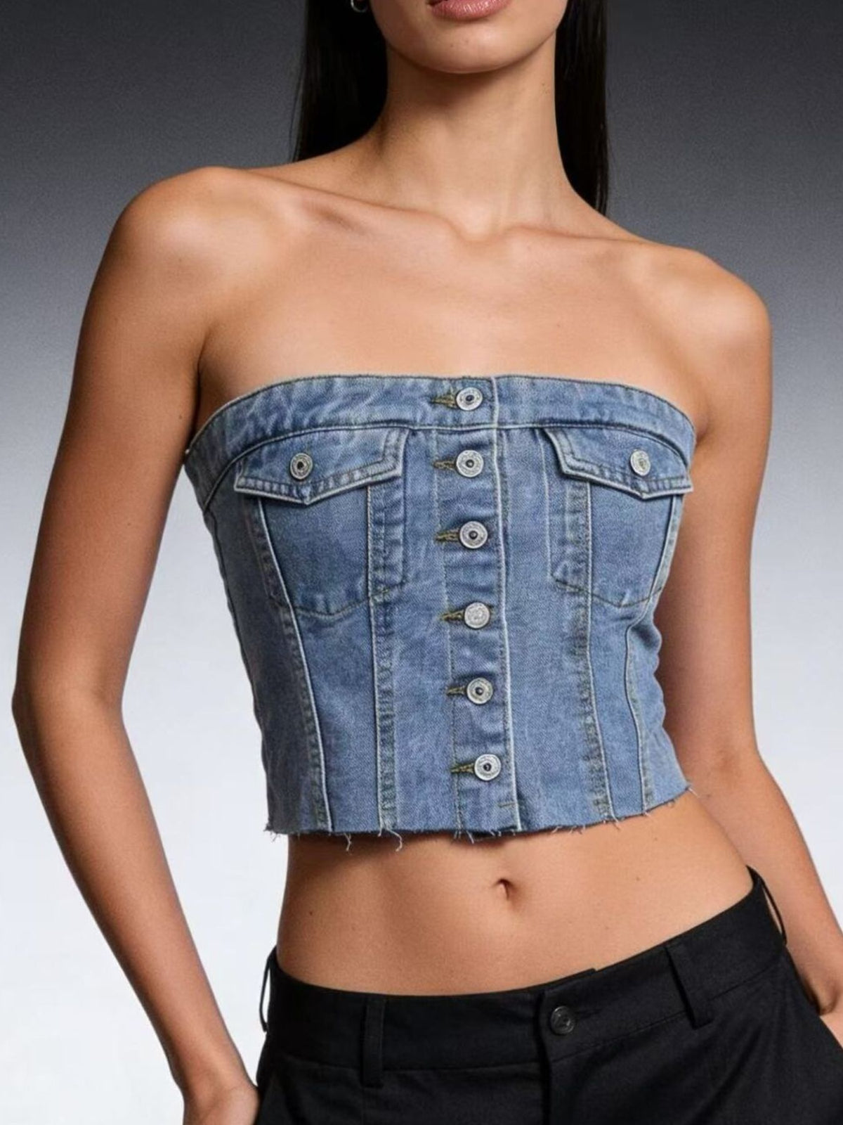 Light blue strapless denim top with button-front closure from Trendsi, styled with a fitted silhouette and sleeveless design.