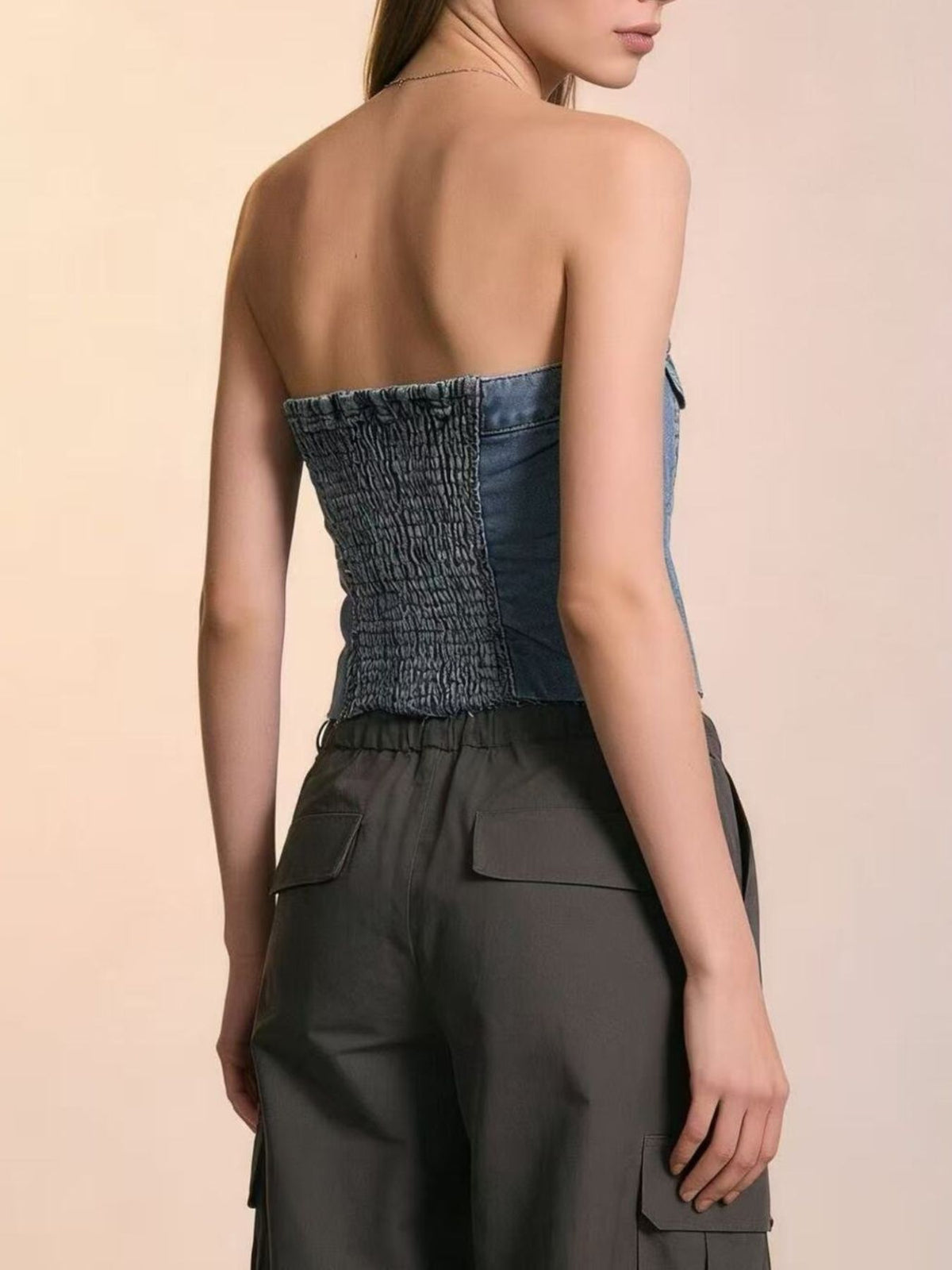 Light blue button-front strapless denim top by Trendsi, displayed on a model, showcasing its fitted style and off-shoulder design.