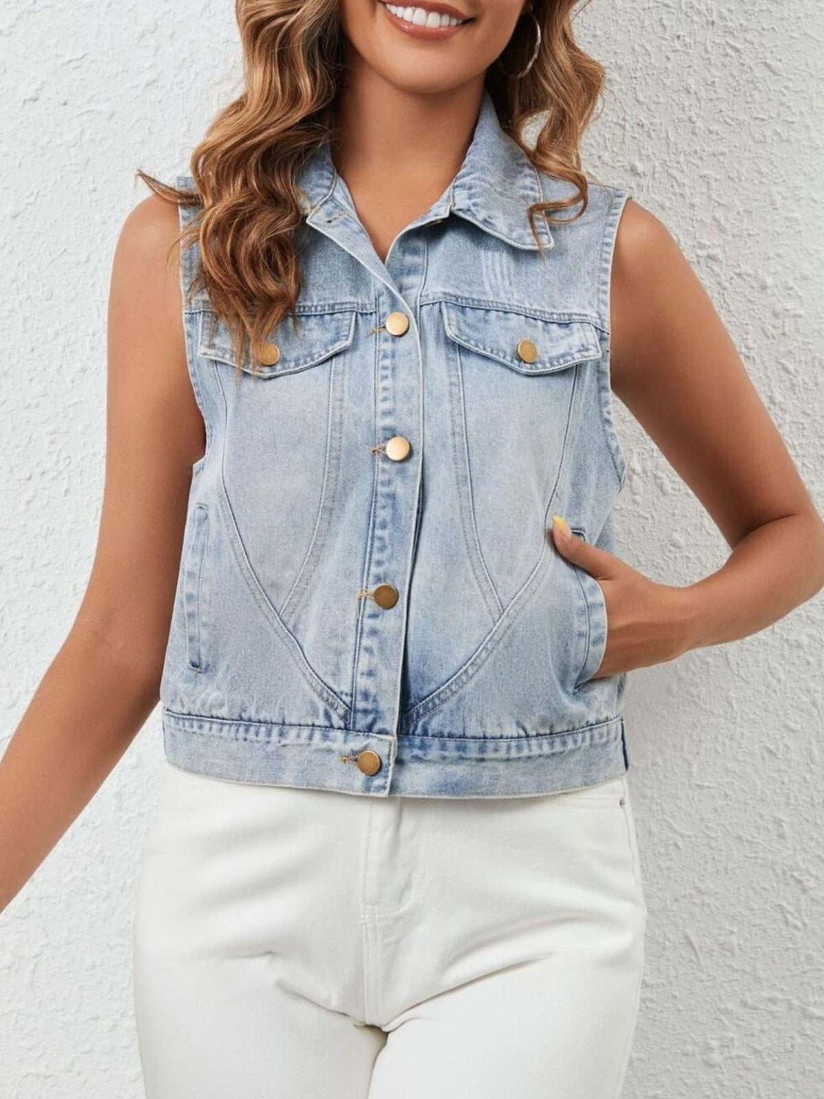 Light blue sleeveless button-up denim jacket by Trendsi, casual stylish outerwear with front pockets and classic denim design.