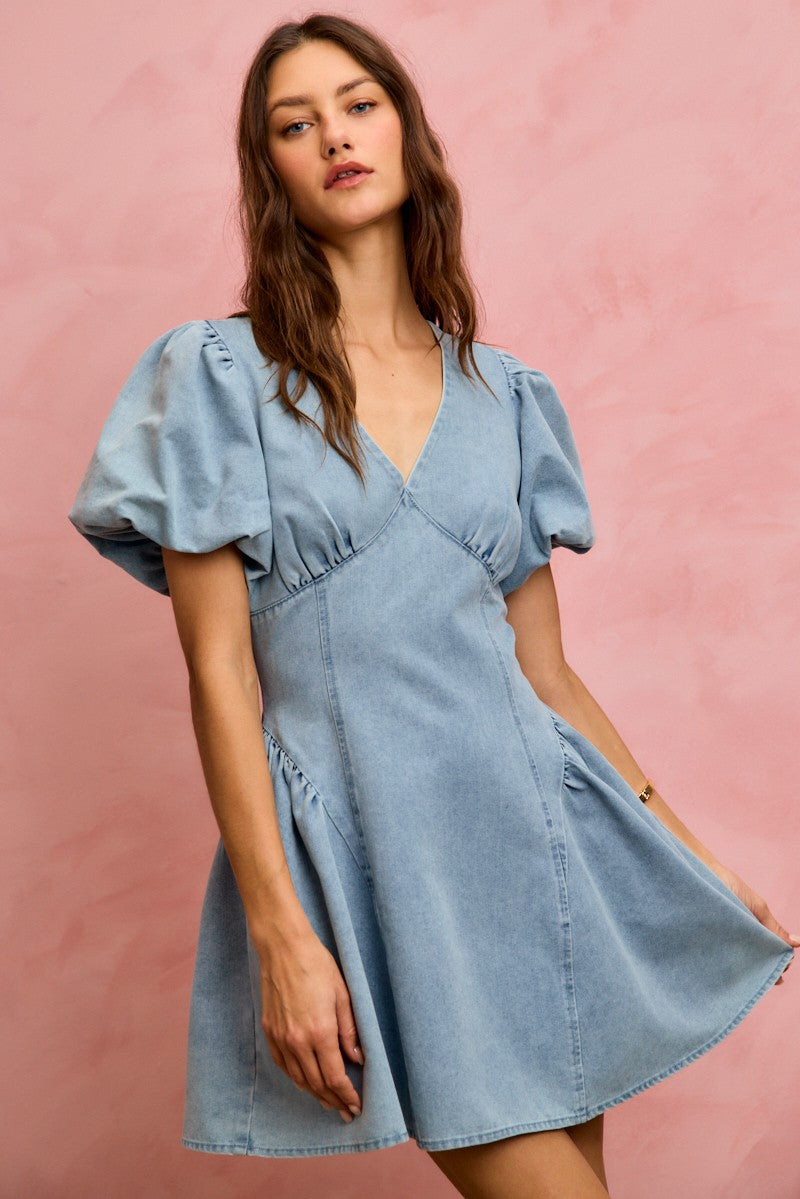 Light denim fit and flare mini dress with bubble sleeves from Trendsi, featuring a stylish and casual denim design.