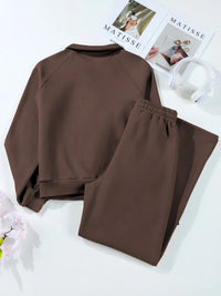 Light gray collared sweatshirt and high-waist active pants set by Trendsi, casual sporty outfit with comfortable fit.