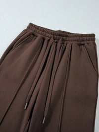 Light gray collared sweatshirt and high-waist active pants set by Trendsi, casual athletic wear for women.