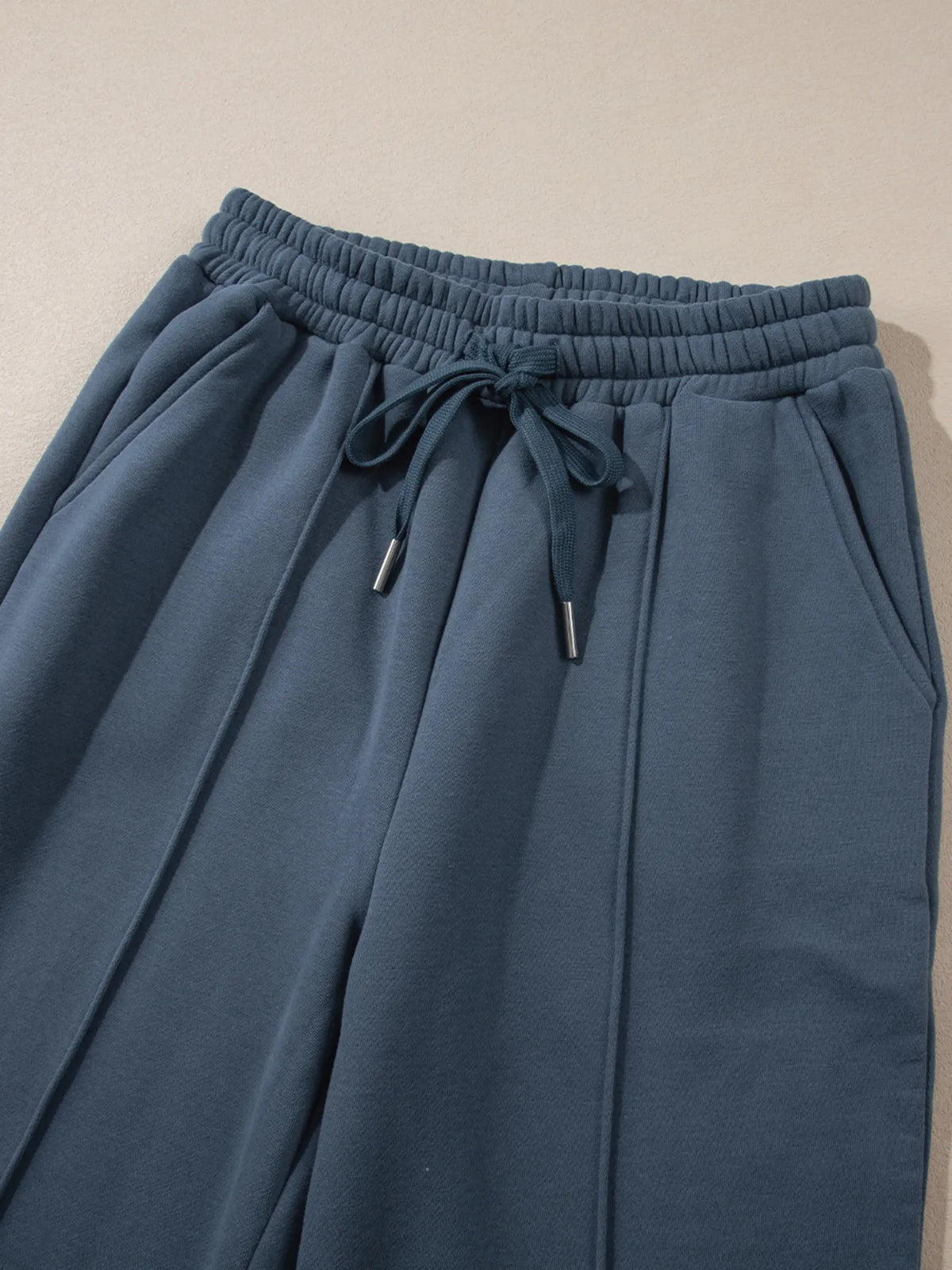 Light gray collared sweatshirt and high-waist pants active set by Trendsi, casual athletic wear for women.
