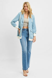 Light gray RISEN one-button blazer with hoodie from Trendsi, shown on a model, featuring a casual yet stylish design.
