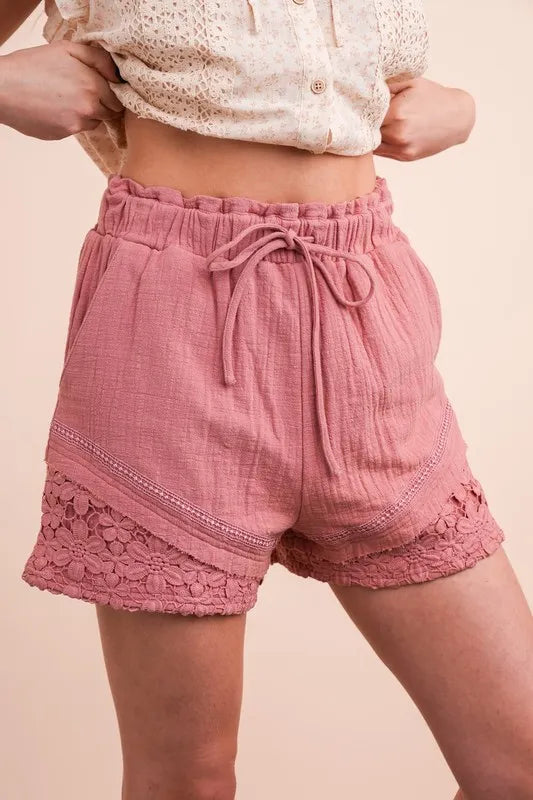Lace contrast detail woven shorts by Trendsi featuring a stylish, lightweight fabric and a relaxed fit for casual wear.