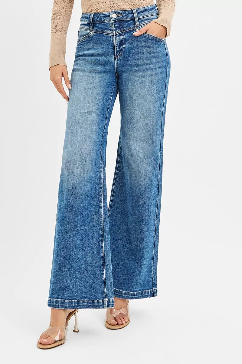 Risen high-rise wide-leg jeans by Trendsi featuring front yoke and heart-shaped back pockets, displayed on a hanger.