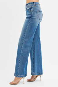 Risen high-rise wide-leg jeans with front yoke and heart-shaped back pockets, displayed on a model.