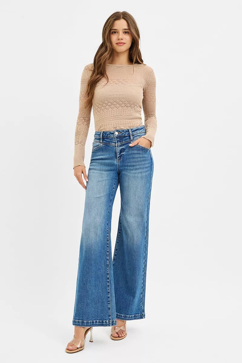 Risen high-rise wide-leg jeans by Trendsi featuring front yoke and heart-shaped back pockets, displayed on a hanger.