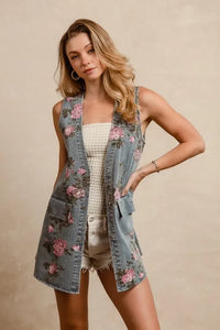 BiBi floral print washed denim long rider vest by Trendsi, with floral details and a casual denim design.