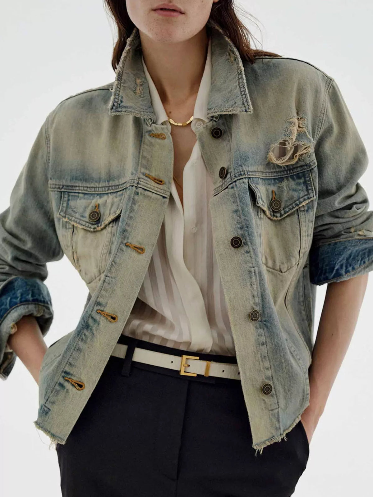 Distressed wash button-up denim jacket by Trendsi featuring a classic fit, frayed details, and casual style.