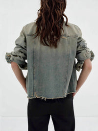 Distressed wash button-up denim jacket by Trendsi, featuring a rugged look, classic collar, and front button closure.