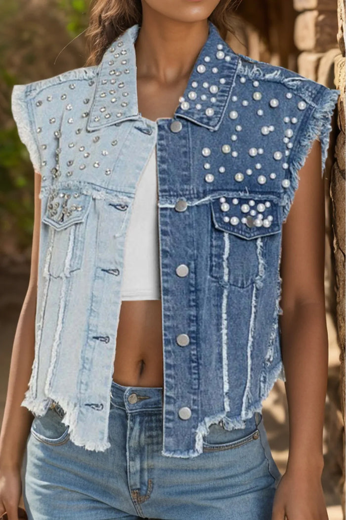 Sleeveless denim jacket with pearl accents and raw hem, trendy Trendsi fashion piece shown in the image.