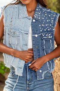 Raw hem sleeveless denim jacket by Trendsi with pearl accents, styled with front pockets and a casual fit.