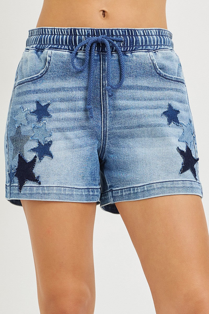 Risen elastic band slouchy denim shorts with star patch details, casual style, relaxed fit, and distressed finish.