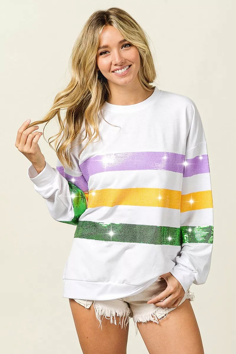 Sequin Mardi Gras striped round neck sweatshirt by Trendsi with colorful sequin patterns and comfortable fit.